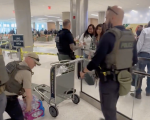 OH, THE HORROR! ICE Agents Hand Out Waters, Tell Folks to Have a Safe Flight at Houston Airport [WATCH]